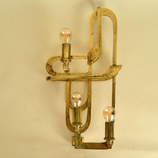 Extraordinaire wall sconce by Frigerio Italy sits somewhere between wall sculpture and lighting. The elongated form and...