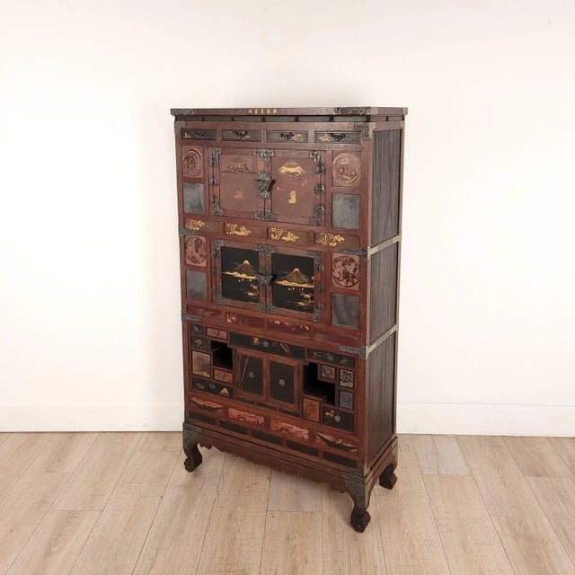 A fine brass inlaid and lacquered Korean tansu with white brass fittings, 19th century.