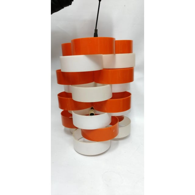 - Original Acrylic Glass chandelier from the 70s - Structured in concentric circles in white and orange - With six E14...