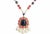 Goldtone faux-lapis, cabochon faux-coral and clear paste with resin faux-baroque pearl pendant with resin faux-pearl,...