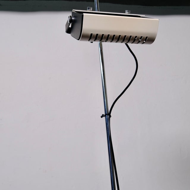 This tall, mid-century-style lamp combines functionality and timeless industrial design. The height-adjustable and...