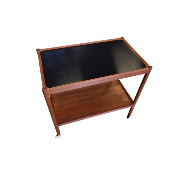 Danish serving trolley and bar trolley in teak and black melamine An elegant and very practical serving trolley in teak...
