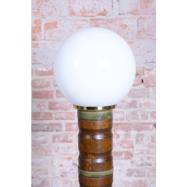 This floor lamp is a noble representative of 1930s Czechoslovak Art Deco. The lighting fixture embodies the elegance,...