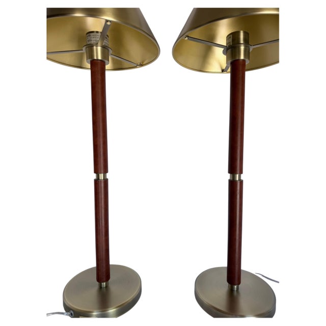 Pair of handsome campaign-style buffet table lamps by Ralph Lauren. These tall classic candlestick lamps feature a conical...