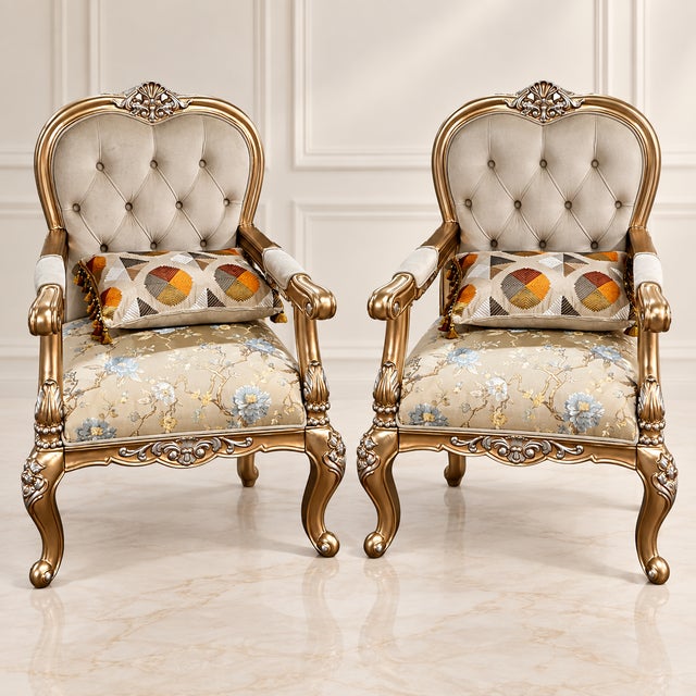 An exceptionally elegant pair of brand-new statement armchairs featuring richly carved gold-finished beech wood frames,...