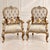 An exceptionally elegant pair of brand-new statement armchairs featuring richly carved gold-finished beech wood frames,...