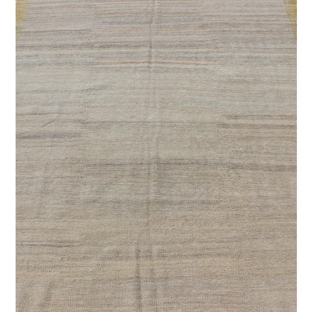 Measures: 5'3 x 6'7 Modern Afghan Kilim Rug in Neutral Beige with Subtle Golden Border 5'3 x 6'7. Keivan Woven Arts /...