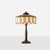 Description Art Nouveau Slag Glass Table Lamp with Metal Overlay United States, c1920s American slag glass table lamp in...