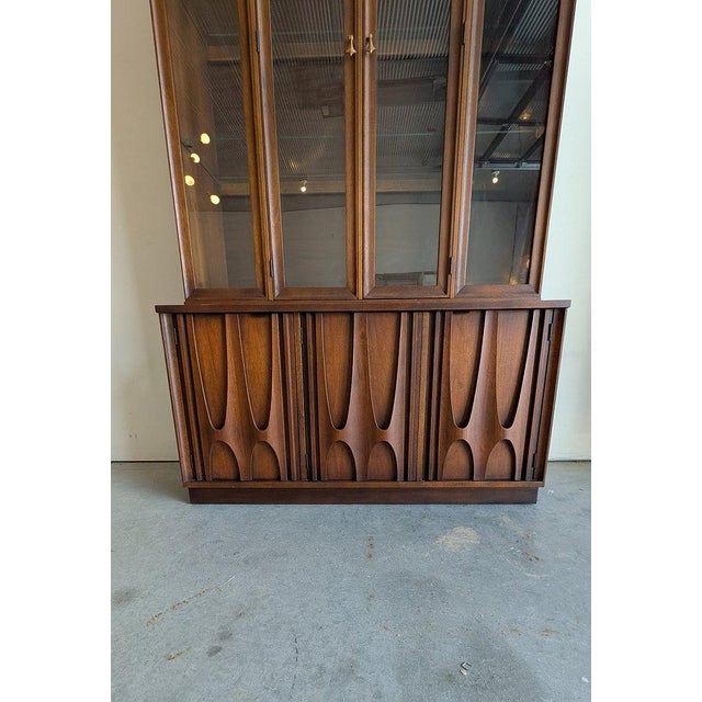 An iconic vintage Mid-Century Modern Brasilia hutch by Broyhill Furniture Co. - one of the most recognizable and...