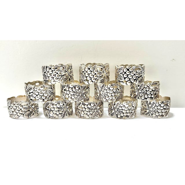 A lovely set of vintage silver plate napkin rings featuring sculpted grape clusters and vine leaves. These detailed rings...