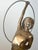 This contemporary bronze figural sculpture titled Christy by Eleanor Cardozo depicts a rhythmic gymnast holding a hoop,...