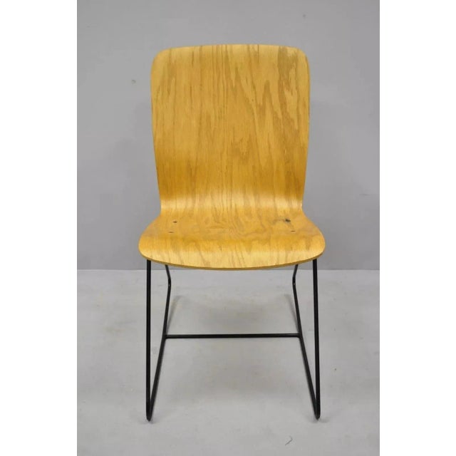Vintage Mid Century Modern Bent Plywood Iron Base Tilt Back Side Chair. Item features a wrought iron tilt back/rocking...