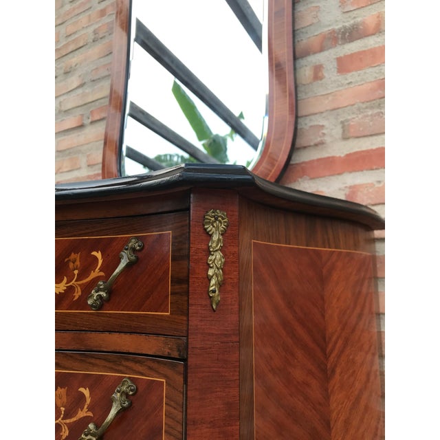 Kingwood and marquetry commode, in Louis XVI transitional style, of serpentine bombe form, fitted three drawers above a...