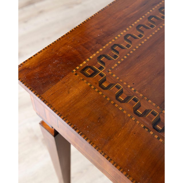 This refined Italian walnut writing table or desk is a beautiful example of neoclassical craftsmanship, combining graceful...