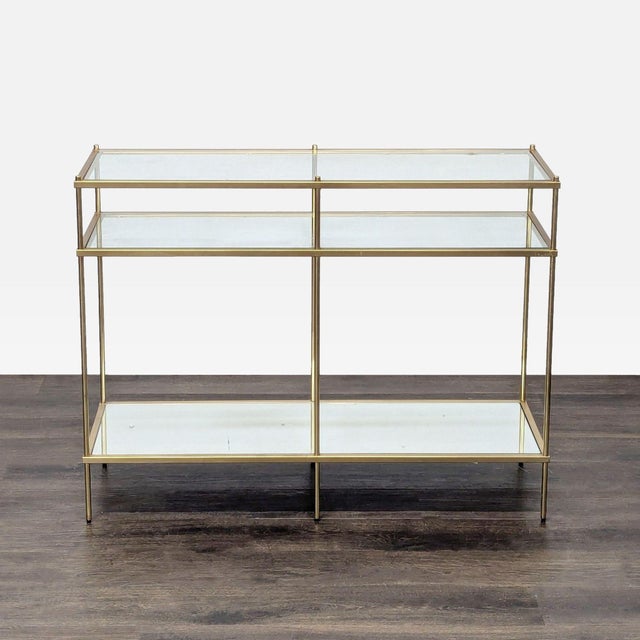 Two Glass Shelves with mirrored bottom shelf on metal frame. Brand: West Elm. Original Price: $399. Dimensions (in): 42W x...