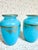 A striking pair of 19th-century blue opaline glass bud vases by Baccarat. Vivid blue glass is finished with gold gilt at...