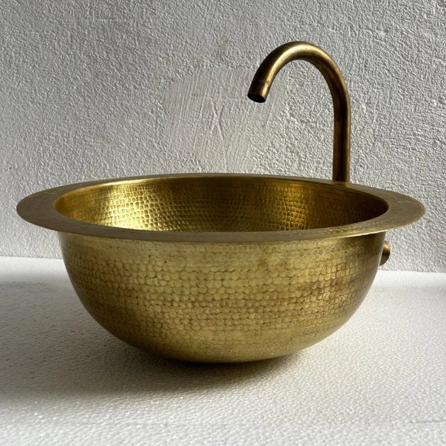 16-Inch Handmade Oval Hammered Brass Sink This exquisite handmade oval sink is crafted from hammered brass, bringing...