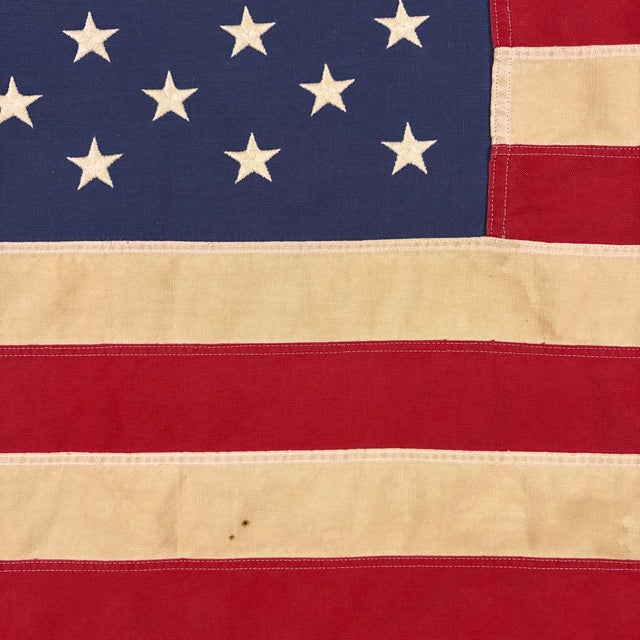 This vintage American flag is made from a cotton cloth with fully sewn stripes and 50 embroidered stars. Please note...