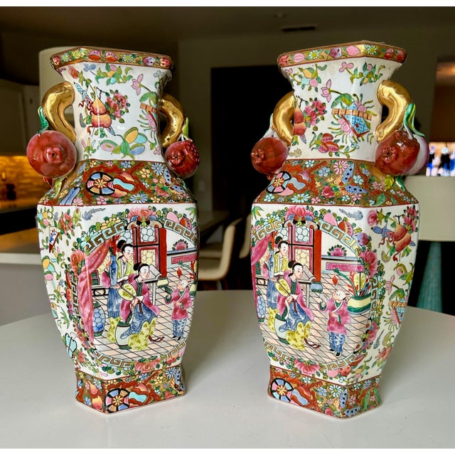 Pair of Chinese Export Rose Medallion porcelain vases (drilled for lamps). They feature panels depicting court scenes...