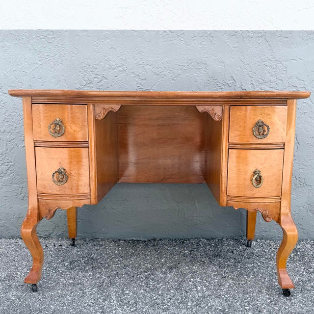 This elegant antique vanity or low writing desk showcases the graceful curves and refined craftsmanship of the Queen Anne...
