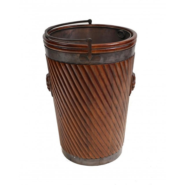 Single Irish peat bucket in mahogany. Great piece that works well as a planter. Brass lined inner. Offered in great shape...