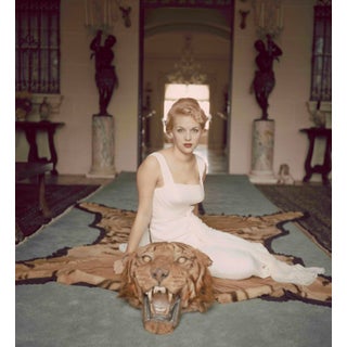 Slim Aarons -Beautiful Lady Daphne Cameron on a Tiger Skin Rug - 1959 Photograph For Sale