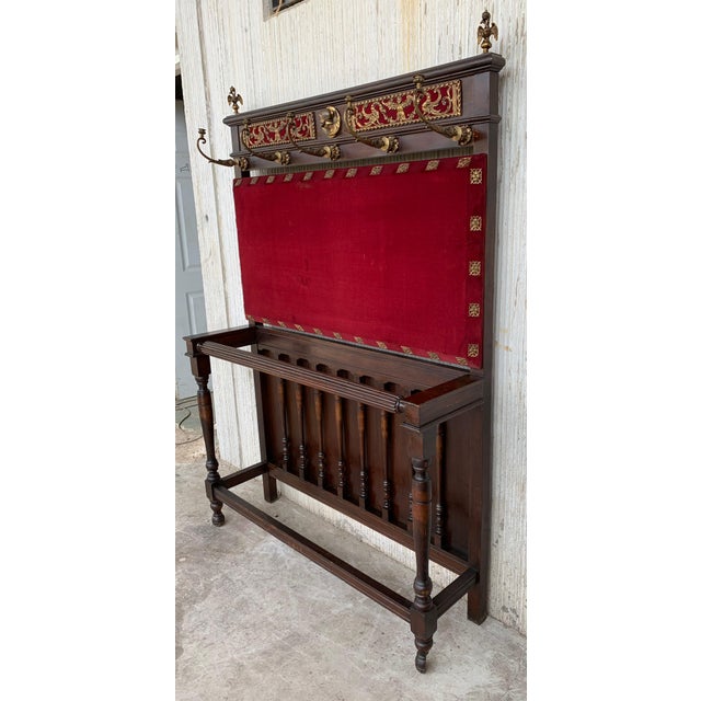 Large carved Spanish solid walnut coat rack stand has all of the original hardware which is heavy cast iron and has been...
