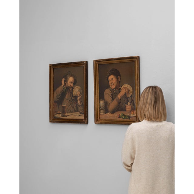 This pair of 20th Century French wall art pieces in wooden frames captures a charming, character-driven glimpse into...