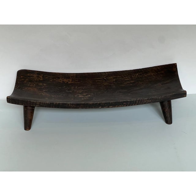 Vintage hand carved convex type tray with four peg feet. The decorative bowl is sturdy and might be a great place to...