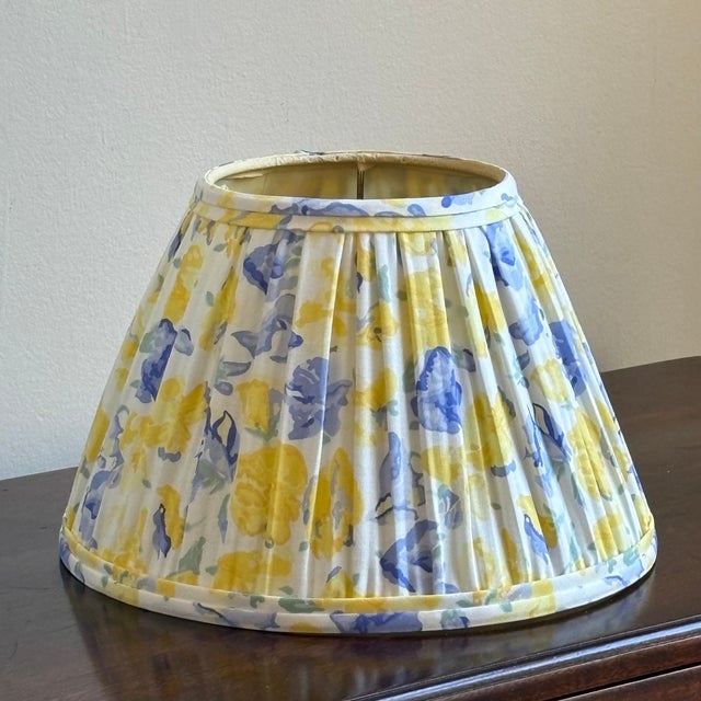 A charming circa 1990 pleated cotton lampshade with a soft floral print over a white backdrop. This shade is equipped with...