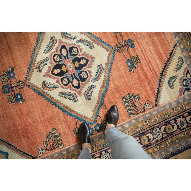 :: Diamond shaped center medallion with interior scalloped minor medallions surrounded by serrated leaf shrimp-like fish...