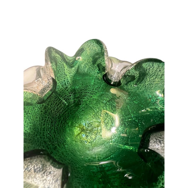 This striking and luminous vintage art glass hails from the world-renowned high quality glass hub of the world: Murano,...