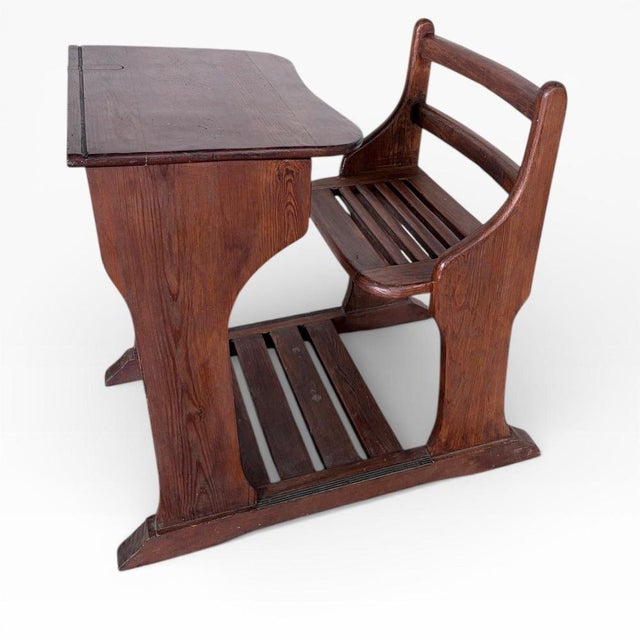 The Victorian school desk is a solid wood desk designed to bring historic charm and practical function into your home or...