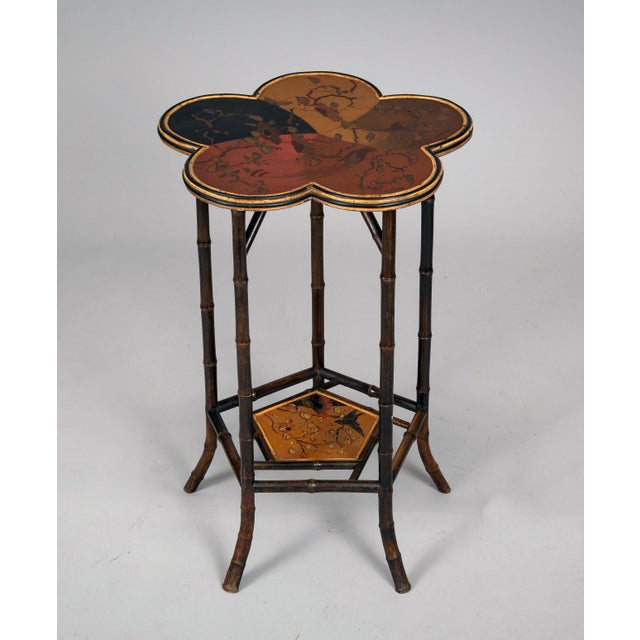 English Aesthetic Movement faux-bamboo table with a deeply scalloped or clover leaf-shaped top, decorated with painted...
