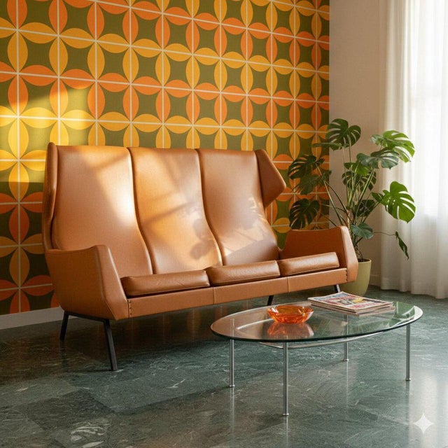 Vintage three-seater sofa with foam padding and original period skai upholstery, enamelled metal legs. Decent condition....