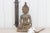 Found in Thailand, this tall antique Buddha was made from bronze. This Thai buddha is show in the "Bhumisparsha Mudra". It...