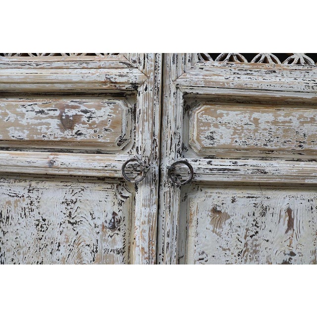 A beautifully balanced set of antique Chinese panels, with "floral" trellis tops, worn white paint finish and superb tall...