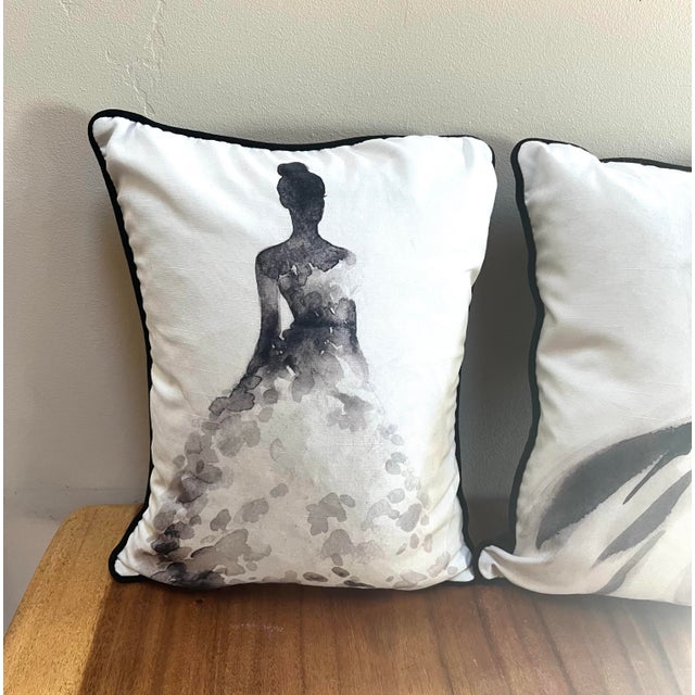 These custom pillows feature watercolor fashion illustrations in a minimalist black-and-white style. Set/2 Piped edges...