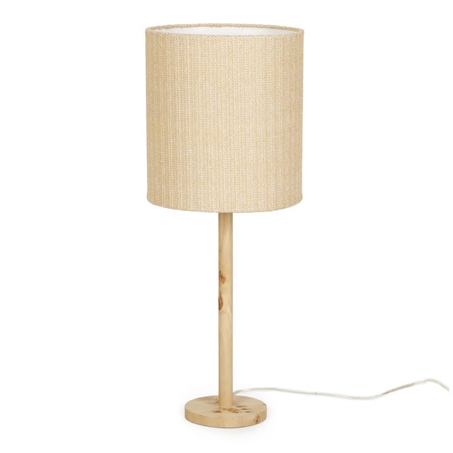 The Lamia Table Lamp adds instant warmth to any room. Its burl-finished base brings natural texture, while the handwoven...