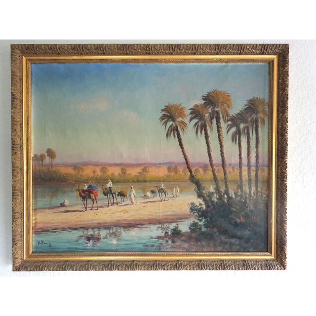 Vincent Manago (1880_ 1936) oil on canvas , signed 65cm x 80 cm " Caravane orientaliste en bord d'eau" Circa 1920's Golden...