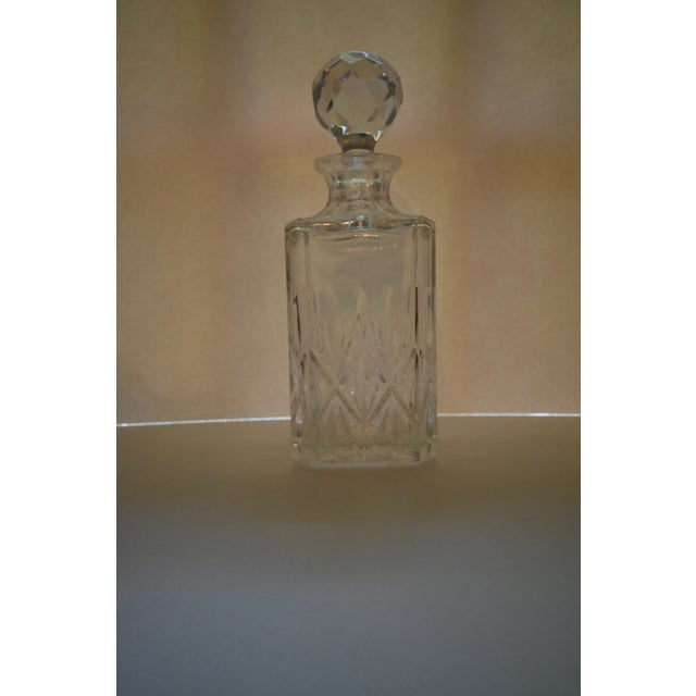 Add elegance to any bar with this Tiffany & Company Crystal Decanter set featuring a decanter and two sniffers in the...