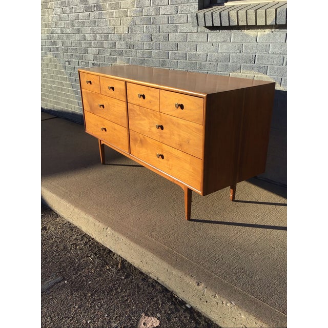 This elegant mid-century modern dresser is part of the iconic Drexel Declaration collection, designed by Kipp Stewart and...