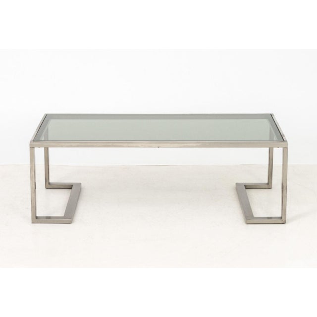 Modern Smoky Glass Top and Silver-Tone Metal Coffee Table, 1970s, rectangular. 15" H x 44.5" W x 22.75" D. Provenance: A...