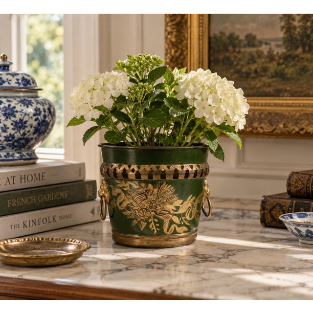 A wonderfully charming early 20th century French tole cachepot finished in an emerald green with delicate gilt...