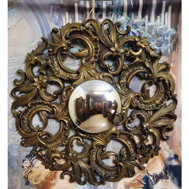Magnificent antique Baroque/Rococo style mirror with a richly carved and gilded frame, adorned with scrolls, shells, and...