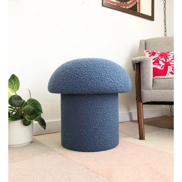 A handmade mushroom shaped ottoman, upholstered in a denim blue colored curly boucle fabric. Perfect for using as a...