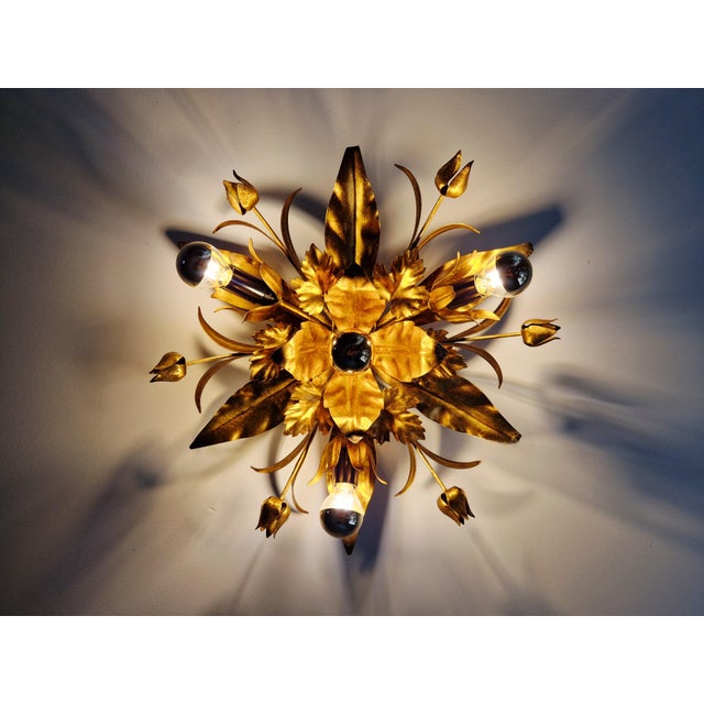 Italian ceiling light in gold-tone metal, Hollywood Regency style with floral decoration, 1970s. Compatible with 4 E14 LED...