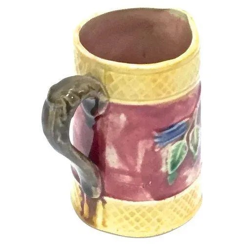 English antique floral and leaf majolica pitcher. Marked "England" on the underside.