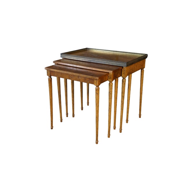 This set of Mid-20th century nesting tables, attributed to the historic Baker Furniture Company, is an exceptional...