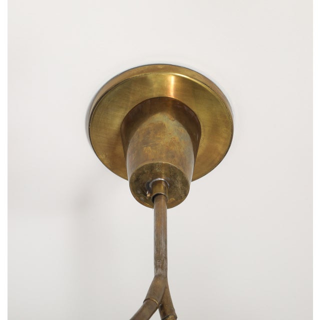 1930s Art Deco brass and glass 8-light pendant, with two new custom art glass panels. Wired for USA. The height/length is...